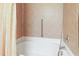 Well-lit bathroom featuring a bathtub and shower at 3108 Forrestal Dr, Durham, NC 27703