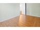Cozy room featuring laminate wood floors, light walls, and doorway at 3108 Forrestal Dr, Durham, NC 27703