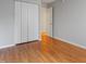Bedroom with hardwood flooring, a closet, and neutral colored walls at 3108 Forrestal Dr, Durham, NC 27703