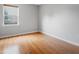 Bedroom with hardwood flooring, a window, and neutral colored walls at 3108 Forrestal Dr, Durham, NC 27703