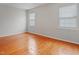 Bright bedroom featuring hardwood floors, two windows and neutral color walls at 3108 Forrestal Dr, Durham, NC 27703