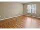 Cozy room featuring laminate wood floors, light walls, window at 3108 Forrestal Dr, Durham, NC 27703