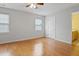 Bedroom with hardwood floors, ceiling fan and access to the bathroom at 3108 Forrestal Dr, Durham, NC 27703