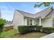 Charming home with light siding, manicured front yard hedges, and close proximity to a fence and neighboring property at 3108 Forrestal Dr, Durham, NC 27703