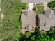 Aerial view showcasing the property's roof, backyard patio, and tree-lined surroundings for privacy at 3304 Rockland Ridge Dr, Cary, NC 27519
