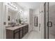 Bathroom features a double vanity, granite countertop, decorative mirrors and a separate shower at 3304 Rockland Ridge Dr, Cary, NC 27519