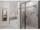 This bathroom features a soaking tub, a separate tile shower and a vanity with a framed mirror at 3304 Rockland Ridge Dr, Cary, NC 27519