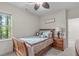 This bedroom features a wood framed bed, carpet floors, and a bedside table with a decorative lamp at 3304 Rockland Ridge Dr, Cary, NC 27519