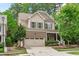 Charming two-story home with brick accents, a well-manicured lawn, and a two-car garage at 3304 Rockland Ridge Dr, Cary, NC 27519