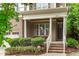 Welcoming front porch with seating, decorative plants, and a charming entrance at 3304 Rockland Ridge Dr, Cary, NC 27519