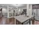 Gourmet kitchen with granite countertops, stainless steel appliances, and an open view to the living room at 3304 Rockland Ridge Dr, Cary, NC 27519