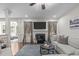 Cozy living room with a fireplace, comfortable seating, and an open layout at 3304 Rockland Ridge Dr, Cary, NC 27519