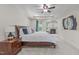 Spacious main bedroom with a tray ceiling, fireplace, and ample natural light at 3304 Rockland Ridge Dr, Cary, NC 27519