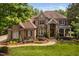 Aerial view of a beautiful two-story brick home with landscaped front yard at 3601 Nightfall Ct, Raleigh, NC 27607