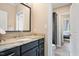 Bathroom featuring a vanity, granite countertop, and doorway to an adjoining room at 3601 Nightfall Ct, Raleigh, NC 27607