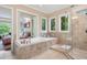 Relaxing bathroom featuring a soaking tub and a seamless glass shower at 3601 Nightfall Ct, Raleigh, NC 27607