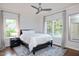 Comfortable bedroom featuring a bed, plush rug, bedside table and a large window at 3601 Nightfall Ct, Raleigh, NC 27607