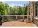 Private wooden deck surrounded by mature trees and greenery for privacy at 3601 Nightfall Ct, Raleigh, NC 27607