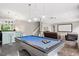 Large game room featuring a pool table, wet bar, and media area for entertainment at 3601 Nightfall Ct, Raleigh, NC 27607