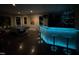 Stylish game room with a uniquely designed pool table and modern, lit-up wet bar area at 3601 Nightfall Ct, Raleigh, NC 27607
