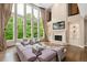 Spacious living room features a fireplace, built-ins, hardwood floors, and an abundance of natural light at 3601 Nightfall Ct, Raleigh, NC 27607