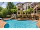 Enjoy this backyard pool, slide, and surrounding mature landscaping, perfect for outdoor fun and relaxation at 3601 Nightfall Ct, Raleigh, NC 27607