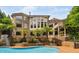 Enjoy this backyard pool, slide, and surrounding mature landscaping, perfect for outdoor fun and relaxation at 3601 Nightfall Ct, Raleigh, NC 27607