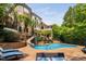 Enjoy this backyard pool, slide, and surrounding mature landscaping, perfect for outdoor fun and relaxation at 3601 Nightfall Ct, Raleigh, NC 27607
