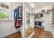 Spacious walk-in closet with custom shelving, hardwood floors and natural light at 3601 Nightfall Ct, Raleigh, NC 27607