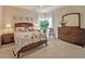 Comfortable bedroom features neutral decor, soft carpeting, and ample natural light at 372 Farnleigh Dr, Chapel Hill, NC 27517