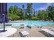 The community pool with umbrellas and chairs provides a refreshing oasis for relaxation and social gatherings at 372 Farnleigh Dr, Chapel Hill, NC 27517