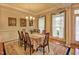 Formal dining room featuring a large table, chandelier, and natural light from large windows at 372 Farnleigh Dr, Chapel Hill, NC 27517