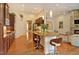 Gourmet kitchen with granite countertops, stainless steel appliances, and a breakfast bar at 372 Farnleigh Dr, Chapel Hill, NC 27517