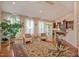 Bright living room with hardwood floors, plush armchairs, and view into the kitchen at 372 Farnleigh Dr, Chapel Hill, NC 27517