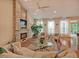 Open-concept living area with a fireplace, plush seating, and plenty of natural light at 372 Farnleigh Dr, Chapel Hill, NC 27517