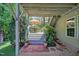 Charming outdoor patio with a dining set and brick accents, nestled in a lush garden at 372 Farnleigh Dr, Chapel Hill, NC 27517