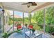 Relaxing screened-in porch with comfortable seating and scenic views of the surrounding nature at 372 Farnleigh Dr, Chapel Hill, NC 27517