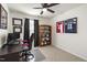 Comfortable bedroom with ceiling fan, desk and chair, sports memorabilia and neutral walls at 3913 Massey Pointe Ct, Raleigh, NC 27616