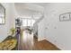 Bright entryway featuring hardwood floors, a staircase, and an open floor plan to the living area at 3913 Massey Pointe Ct, Raleigh, NC 27616