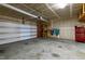 Spacious two-car garage with overhead lighting and ample storage space; perfect for vehicles and hobbies at 3913 Massey Pointe Ct, Raleigh, NC 27616