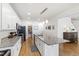 Kitchen features an island, stainless steel appliances, granite countertops, and ample cabinet space at 3913 Massey Pointe Ct, Raleigh, NC 27616