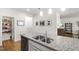 Spacious kitchen island with double sink and granite countertops, pantry and stainless steel appliances at 3913 Massey Pointe Ct, Raleigh, NC 27616