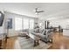 Bright living room featuring an open floor plan, comfortable seating, and natural light from large windows at 3913 Massey Pointe Ct, Raleigh, NC 27616