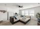 Spacious living room with ceiling fan and a plush sectional sofa with decorative pillows at 3913 Massey Pointe Ct, Raleigh, NC 27616