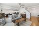 Open living room with hardwood floors, comfortable seating, and a view of the kitchen and dining area at 3913 Massey Pointe Ct, Raleigh, NC 27616