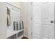 Mudroom features a bench with hooks and storage, perfect for organization at 3913 Massey Pointe Ct, Raleigh, NC 27616