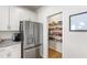 Walk-in pantry in kitchen with white shelves and fully stocked at 3913 Massey Pointe Ct, Raleigh, NC 27616