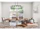 Dining room decor with modern table, chairs, pendant lighting, and granite countertops at 407 Sparella St, Durham, NC 27703