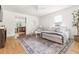 Spacious living room with hardwood floors, neutral decor, a large sectional sofa, and great natural light at 407 Sparella St, Durham, NC 27703