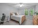 Inviting bedroom with a ceiling fan, a study desk, and natural light at 408 Dairy Farm Dr, Hillsborough, NC 27278